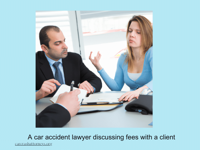 A car accident lawyer discussing fees with a client