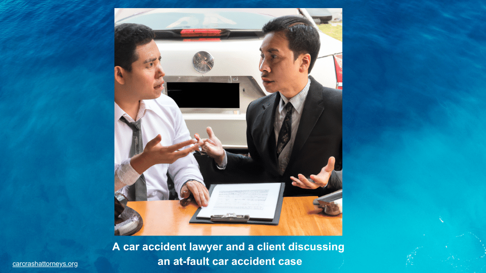 A car accident lawyer and a client discussing an at-fault car accident case
